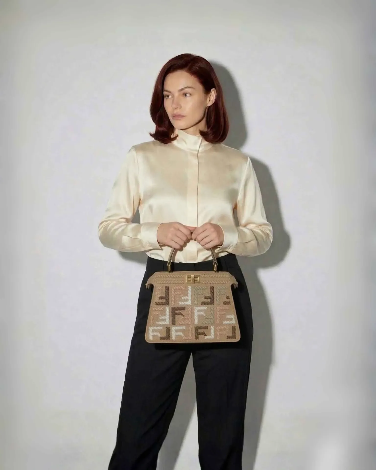Classic Modern" Handbag with Embossed Patterns and Gold Lock